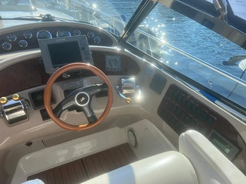 Slide: The Image of Interior of 2000 Sea Ray 460 Sundancer yacht with white leather seating. - 21