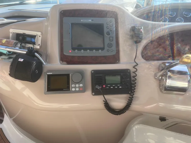 Slide: The Image of Control panel of a 2000 Sea Ray 460 Sundancer boat with navigation equipment. - 23