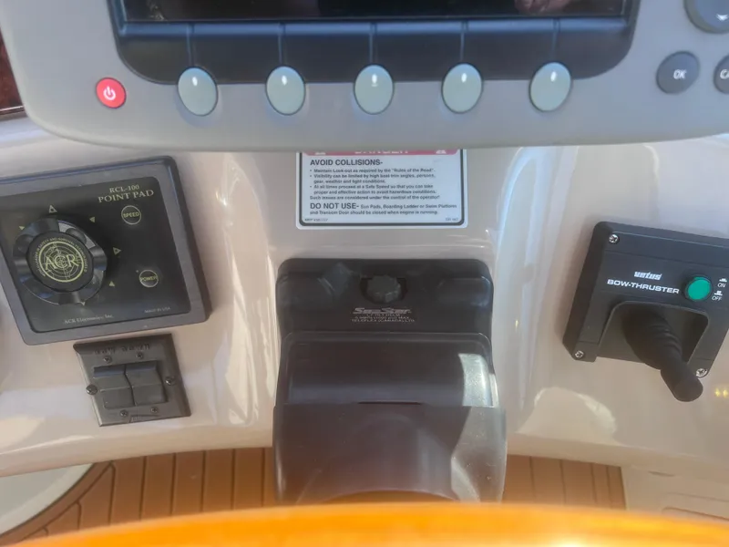 Slide: The Image of Control panel of a 2000 Sea Ray 460 Sundancer yacht with navigation equipment. - 24