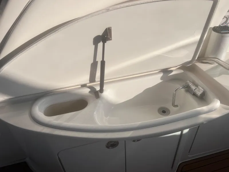 Slide: The Image of Open refrigerator on 2000 Sea Ray 460 Sundancer yacht, showing interior and door. - 28