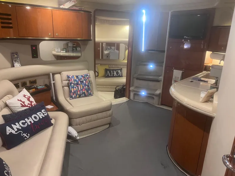 Slide: The Image of Interior of 2000 Sea Ray 460 Sundancer yacht with modern furnishings and ambient lighting. - 35