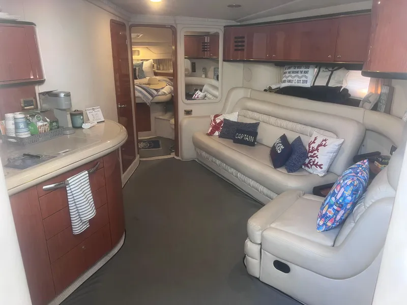 Slide: The Image of Luxurious kitchen interior of 2000 Sea Ray 460 Sundancer yacht with wooden cabinetry. - 37