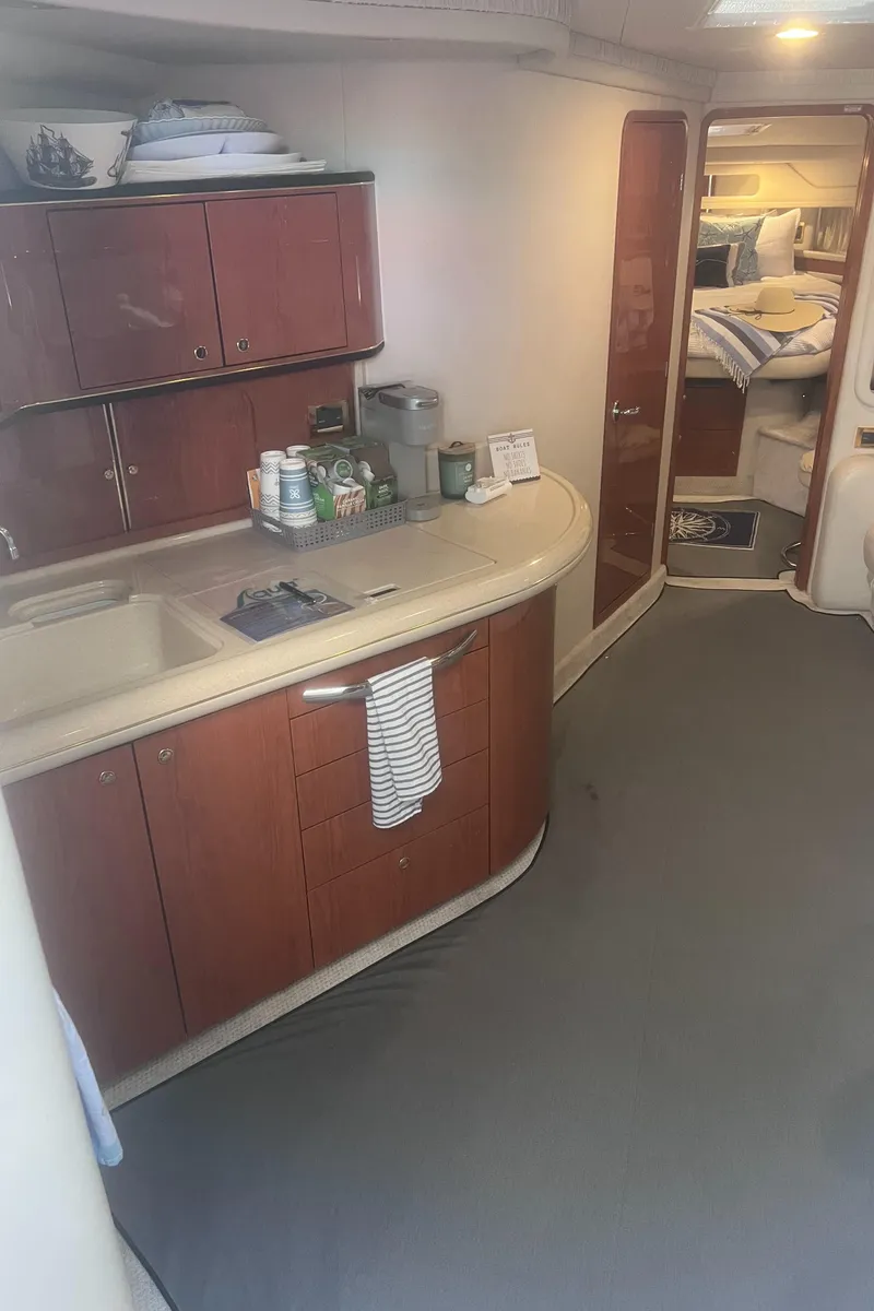 Slide: The Image of Interior of 2000 Sea Ray 460 Sundancer yacht with cozy seating and modern amenities. - 38