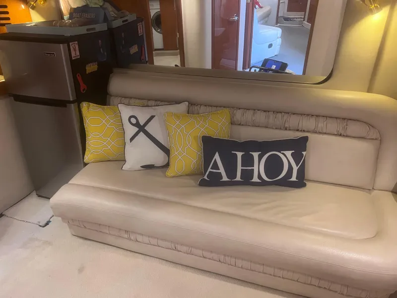 Slide: The Image of Open refrigerator inside a 2000 Sea Ray 460 Sundancer yacht, stocked with various beverages and condiments. - 41