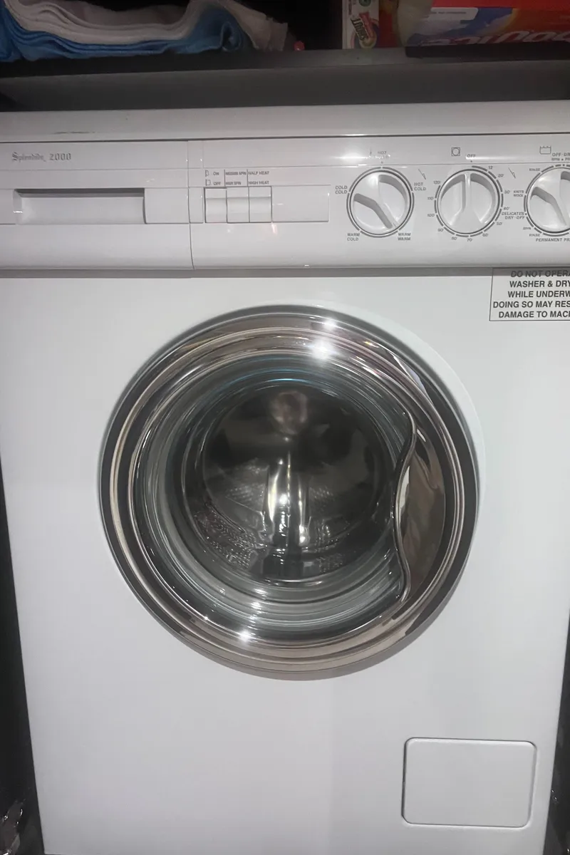 Slide: The Image of Interior of 2000 Sea Ray 460 Sundancer with sofa, pillows, and washing machine. - 43