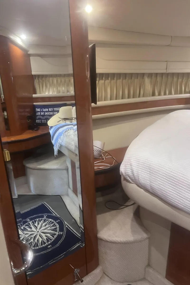 Slide: The Image of Luxurious cabin interior of 2000 Sea Ray 460 Sundancer yacht with cozy bedding. - 49