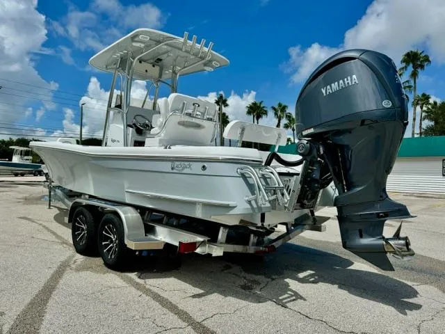Slide: The Image of 2025 BlackJack 256 Coastal boat with Yamaha outboard motor on a trailer. - 2