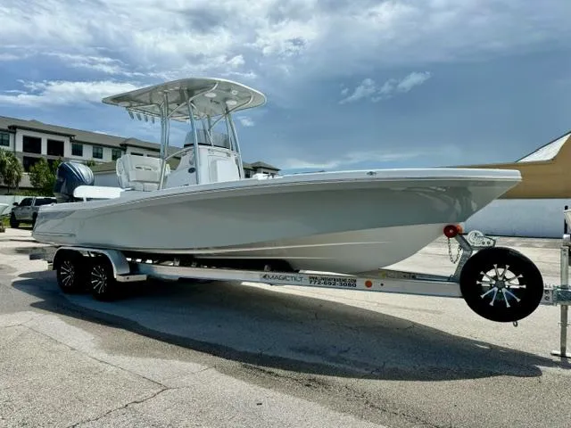 Slide: The Image of 2025 BlackJack 256 Coastal boat on trailer under clear sky. - 6