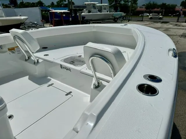 Slide: The Image of 2025 BlackJack 256 Coastal boat interior with seating and storage compartments. - 7