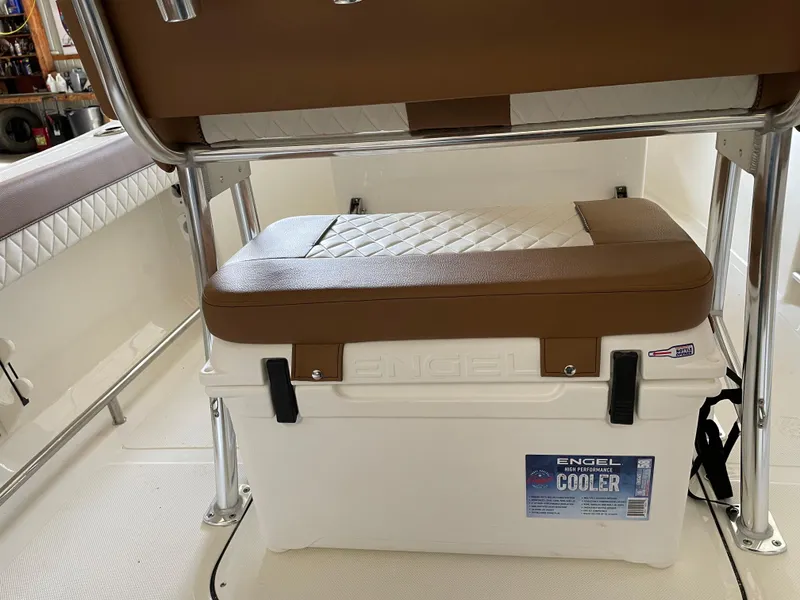 Slide: The Image of 2024 Pioneer 202 Islander boat interior with Engel cooler and cushioned seating. - 8