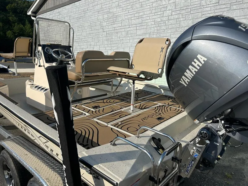 Slide: The Image of 2025 Xpress H20 BAY boat with Yamaha engine, featuring spacious seating and modern design. - 5