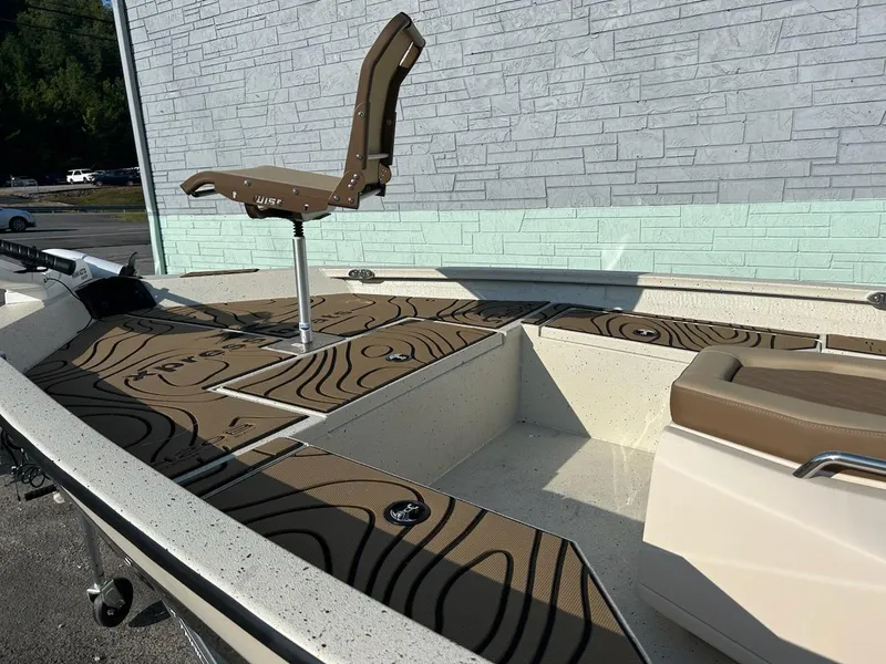 Slide: The Image of 2025 Xpress H20 BAY boat interior with swivel seat and patterned flooring. - 6