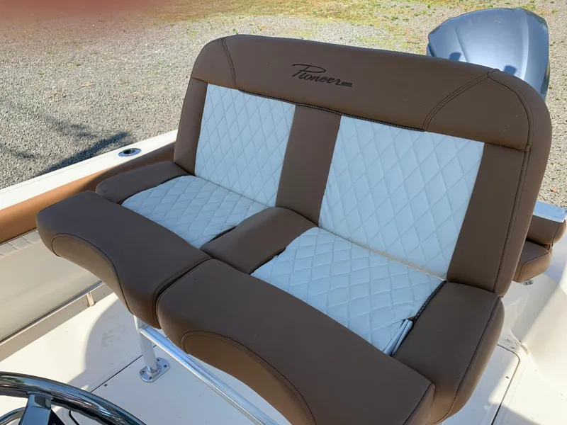 Slide: The Image of 2024 Pioneer 222 Islander boat seat with brown and white quilted upholstery. - 20