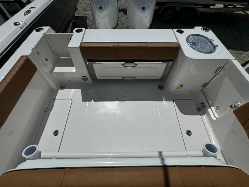 Slide: The Image of 2025 Robalo R250 Center Console boat interior with seating and storage compartments. - 10