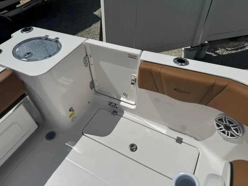 Slide: The Image of 2025 Robalo R250 Center Console boat interior with storage and seating. - 11