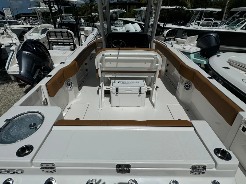 Slide: The Image of 2025 Robalo R250 Center Console boat interior with seating and storage. - 3