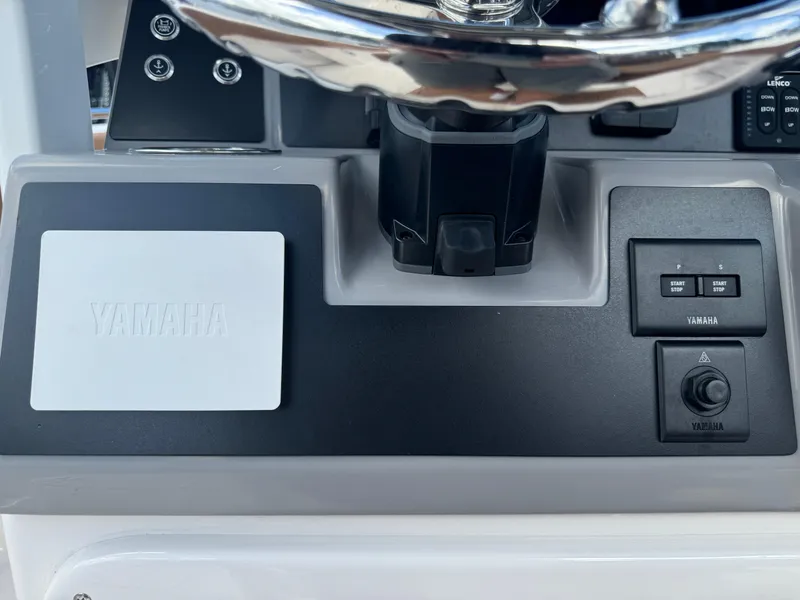 Slide: The Image of 2025 Robalo R250 Center Console dashboard with Yamaha controls and steering wheel. - 30