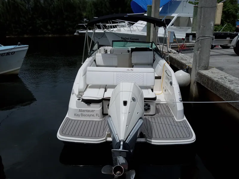 Slide: The Image of 2022 Sea Ray SDX 250 Outboard boat docked in marina. - 12