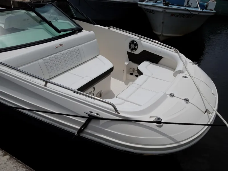 Slide: The Image of 2022 Sea Ray SDX 250 Outboard boat with white seating and sleek design. - 13