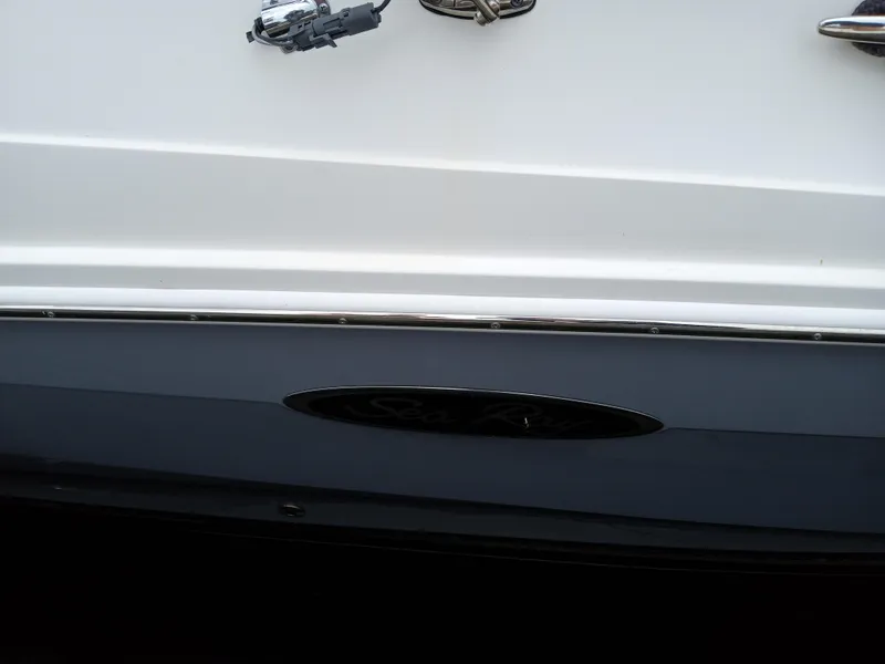 Slide: The Image of 2022 Sea Ray SDX 250 Outboard boat detail with sleek design elements. - 17