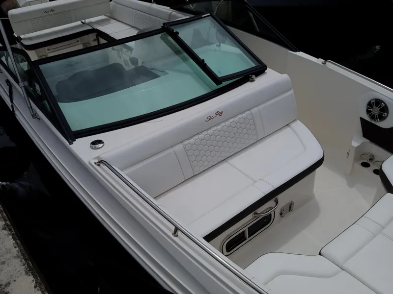 Slide: The Image of 2022 Sea Ray SDX 250 Outboard boat interior with white seating and windshield. - 19