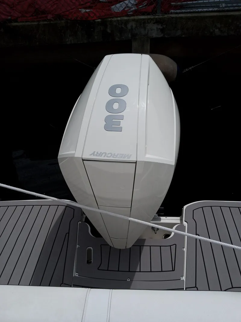 Slide: The Image of 2022 Sea Ray SDX 250 Outboard with Mercury 300 engine, docked. - 2