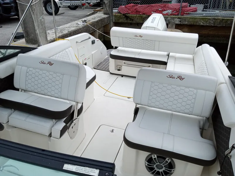 Slide: The Image of 2022 Sea Ray SDX 250 Outboard boat interior with white seating and modern design. - 22