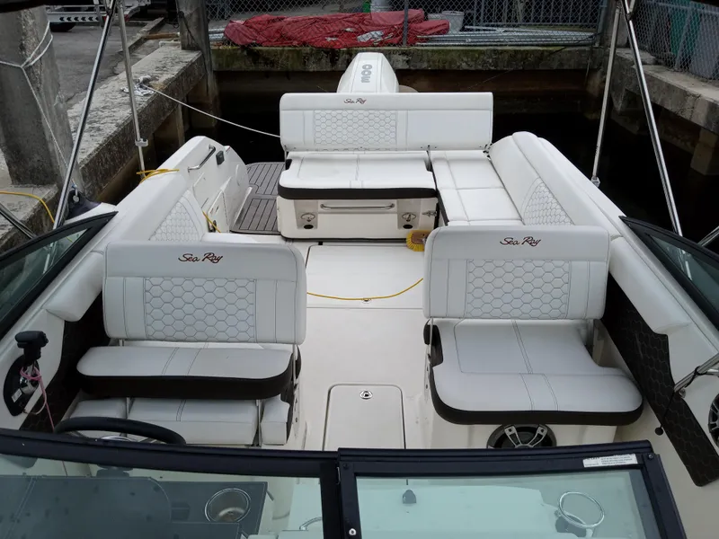 Slide: The Image of 2022 Sea Ray SDX 250 Outboard boat with luxurious white seating and spacious deck. - 26