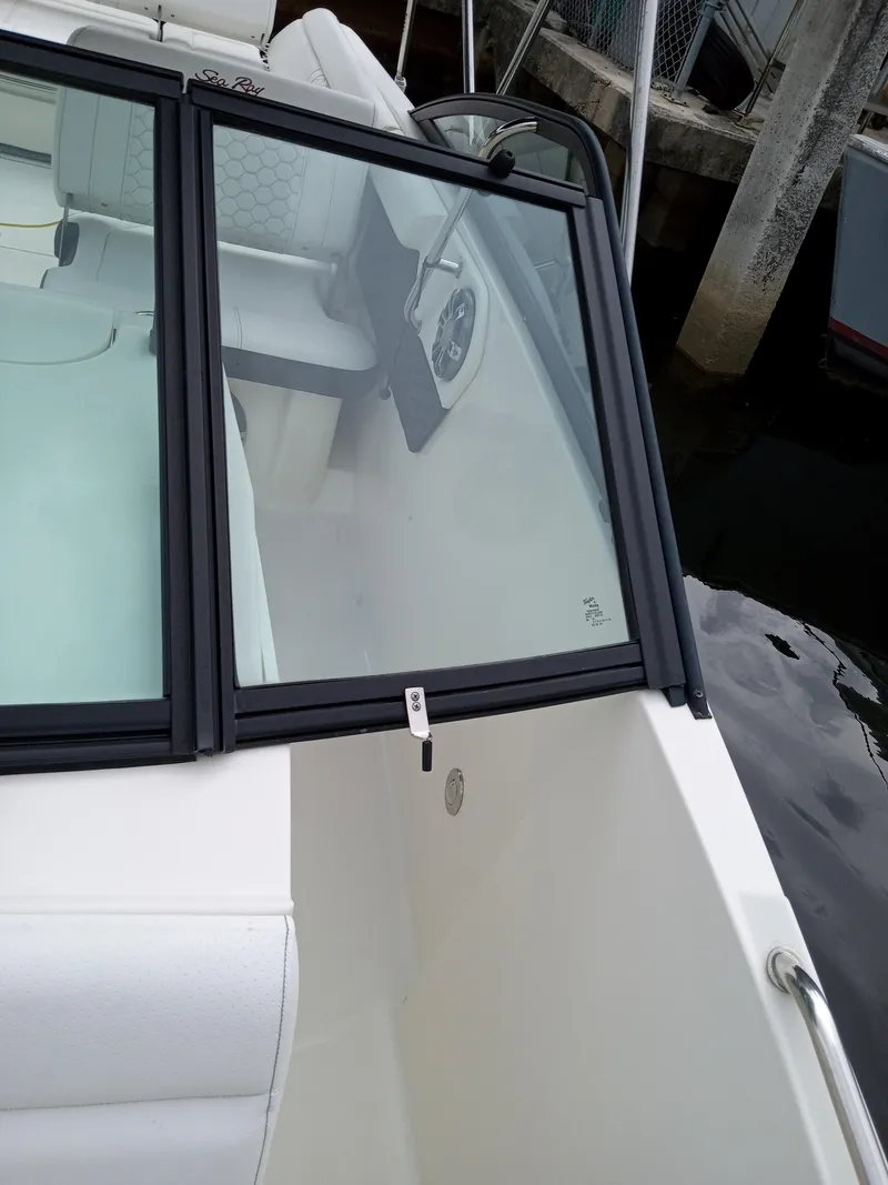 Slide: The Image of 2022 Sea Ray SDX 250 Outboard boat, featuring sleek design and spacious seating. - 42