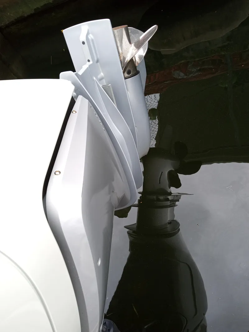 Slide: The Image of 2022 Sea Ray SDX 250 Outboard motor reflected in water. - 46