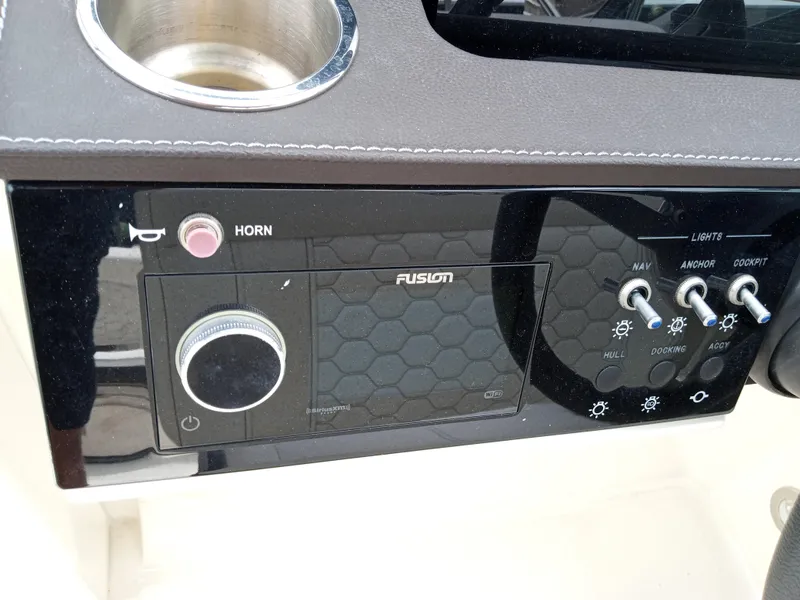 Slide: The Image of Control panel of 2022 Sea Ray SDX 250 Outboard with Fusion audio system. - 6