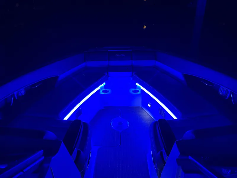 Slide: The Image of 2016 Sea Ray 350 SLX boat interior with blue LED lighting. - 14
