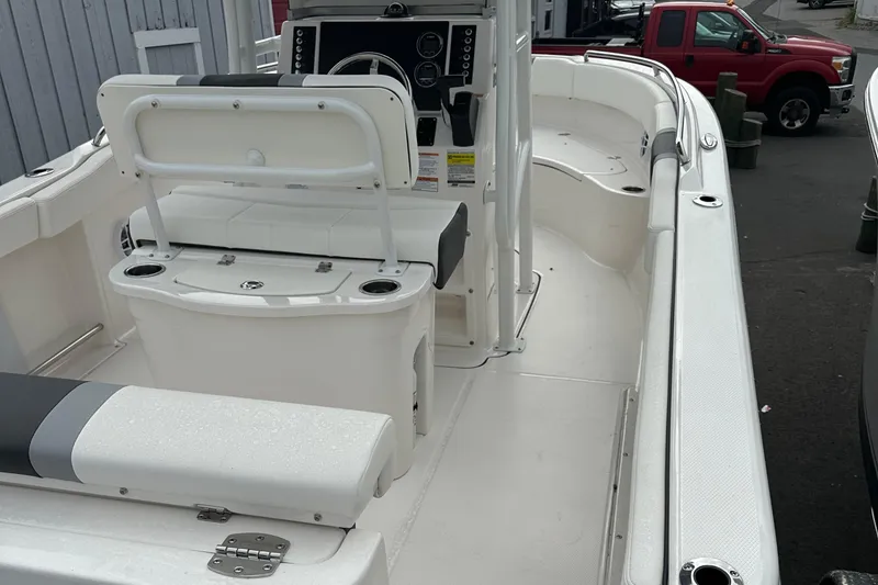 Slide: The Image of 2025 Robalo R222 Center Console boat interior with seating and control panel. - 5