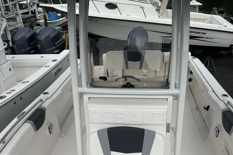 Slide: The Image of 2025 Robalo R222 Center Console boat with sleek design and modern features. - 8