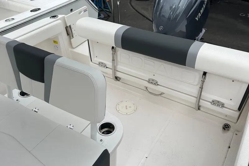 Slide: The Image of 2025 Robalo R222 Center Console boat interior with seating and Yamaha engine. - 9
