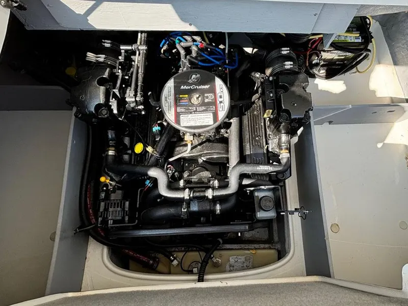 Slide: The Image of Engine compartment of a 2010 Bayliner 215 BR boat with MerCruiser engine. - 8
