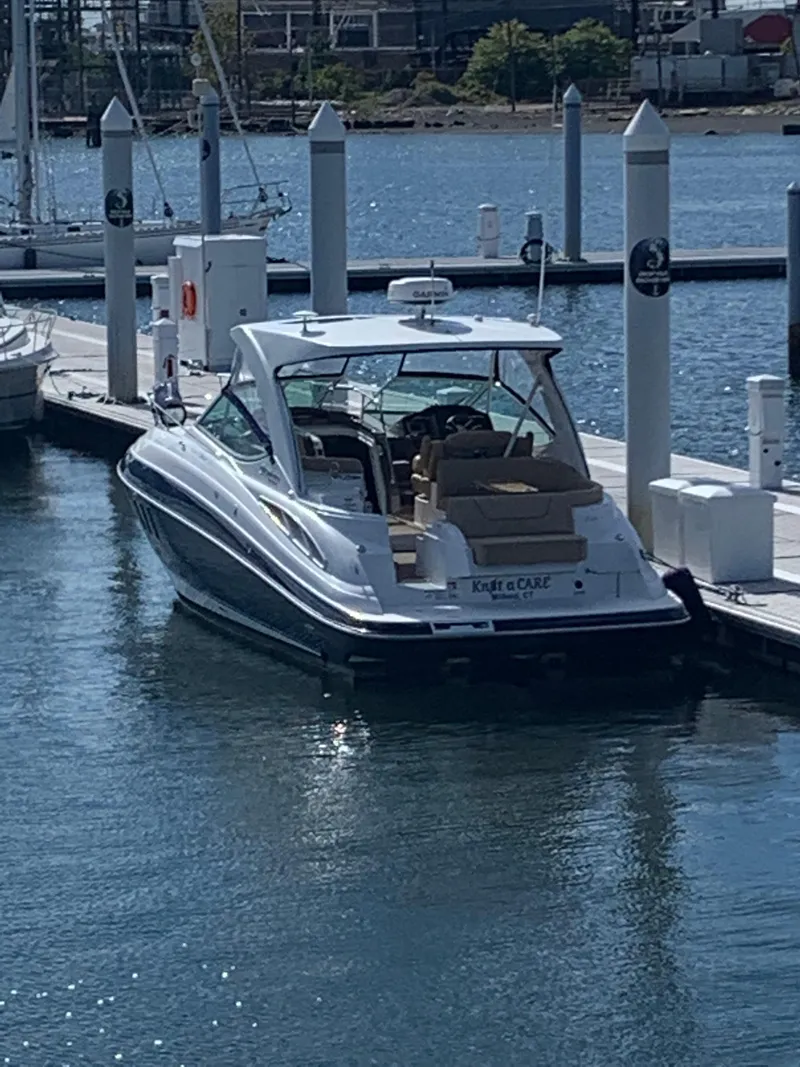 Slide: The Image of 2015 Cruisers Yachts 350 Express docked in a marina. - 1