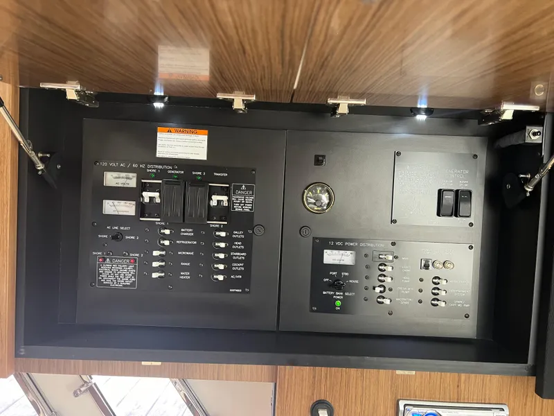 Slide: The Image of Electrical panel of 2015 Cruisers Yachts 350 Express with switches and controls. - 18