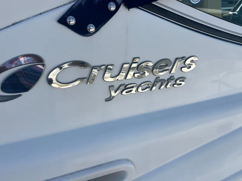 Slide: The Image of Cruisers Yachts 350 Express 2015 logo on white boat exterior. - 20