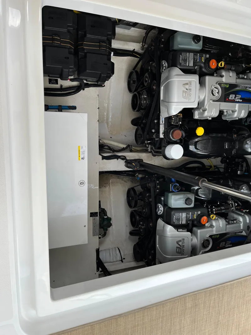 Slide: The Image of Engine compartment of 2015 Cruisers Yachts 350 Express, showcasing dual engines and components. - 4