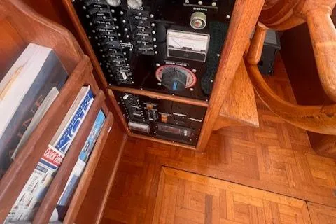 Slide: The Image of Control panel and wooden interior of 1980 Grand Banks 32 Flybridge Trawler. - 11