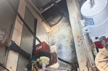 Slide: The Image of Engine room of 1980 Grand Banks 32 Flybridge Trawler, showing mechanical components and equipment. - 33