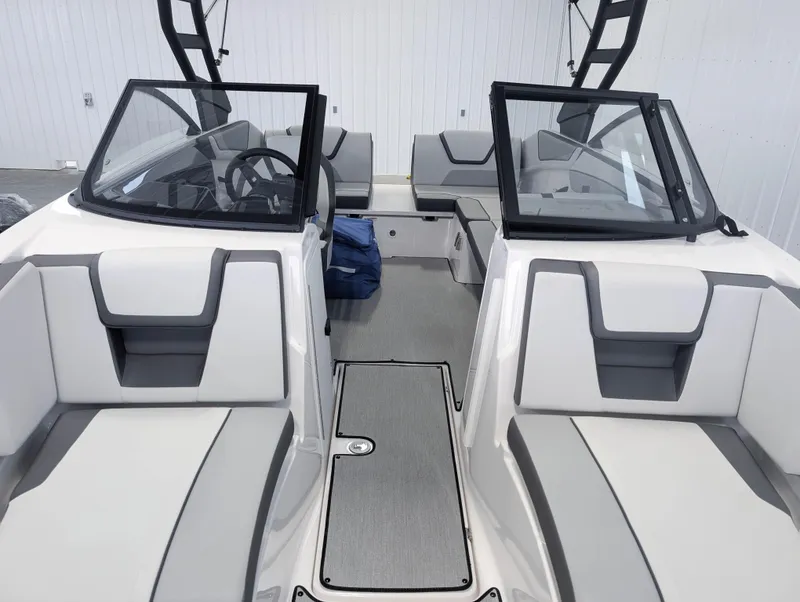 Slide: The Image of 2025 Yamaha Boats AR220 interior with sleek seating and modern design. - 12