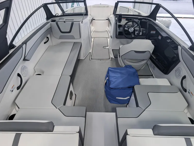 Slide: The Image of 2025 Yamaha Boats AR220 interior with modern seating and steering wheel. - 6
