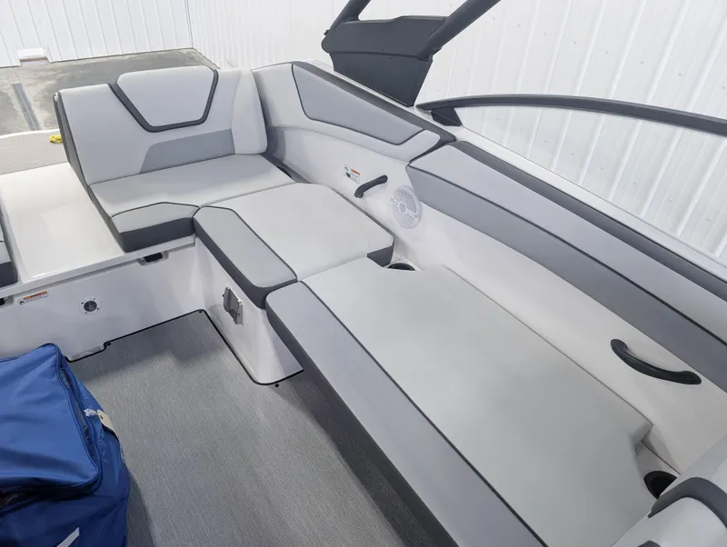 Slide: The Image of 2025 Yamaha Boats AR220 interior with gray seating and modern design. - 9