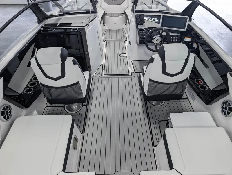 Slide: The Image of 2025 Yamaha Boats 222SE interior with modern helm, seating, and sleek design. - 17