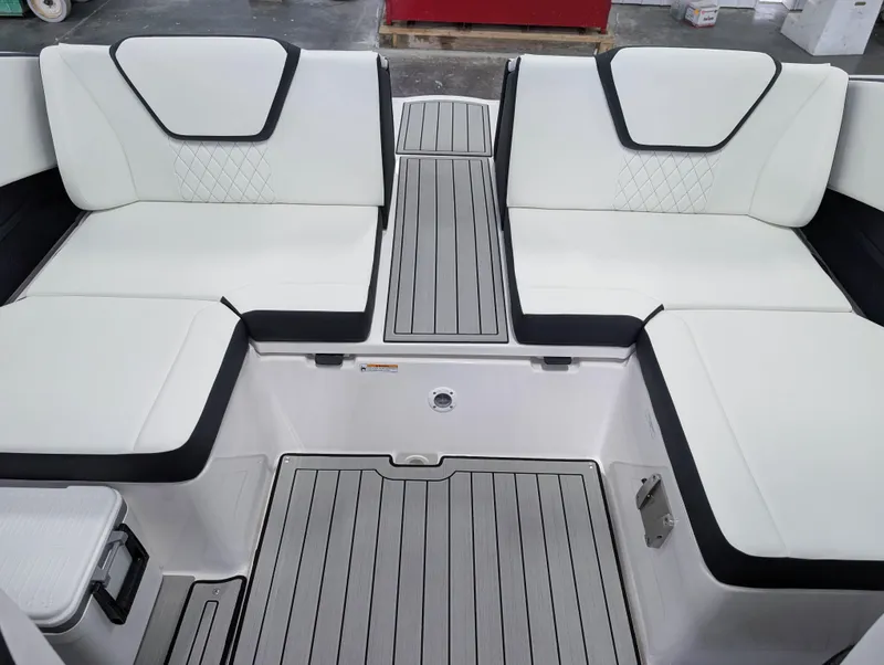 Slide: The Image of 2025 Yamaha Boats 222SE interior with white seating and sleek design. - 19
