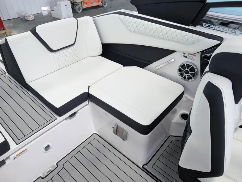 Slide: The Image of 2025 Yamaha Boats 222SE interior with white seating and modern design. - 20