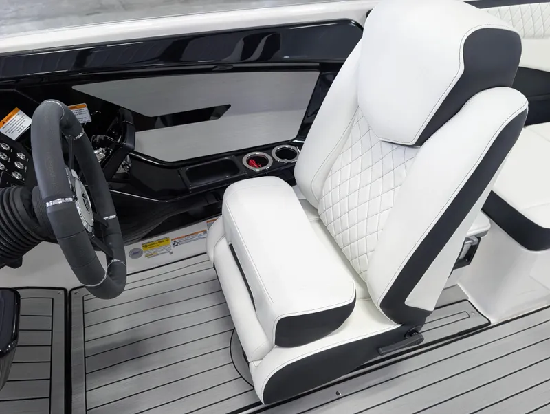 Slide: The Image of 2025 Yamaha Boats 222SE cockpit with luxurious white seating and modern steering wheel. - 24