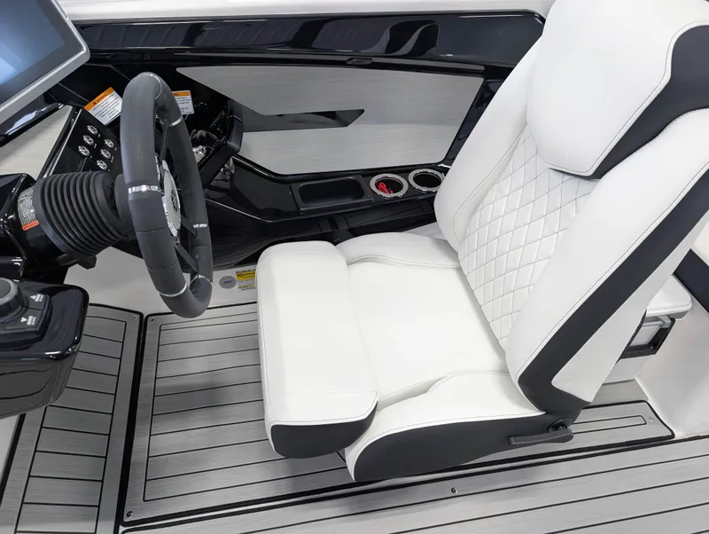 Slide: The Image of 2025 Yamaha Boats 222SE cockpit with sleek steering wheel and luxurious white seating. - 25
